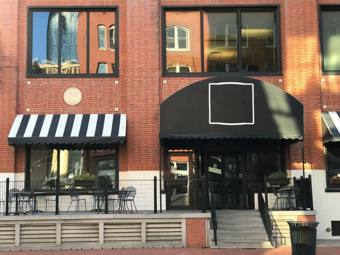 The shopfront of an independent restaurant on a city street